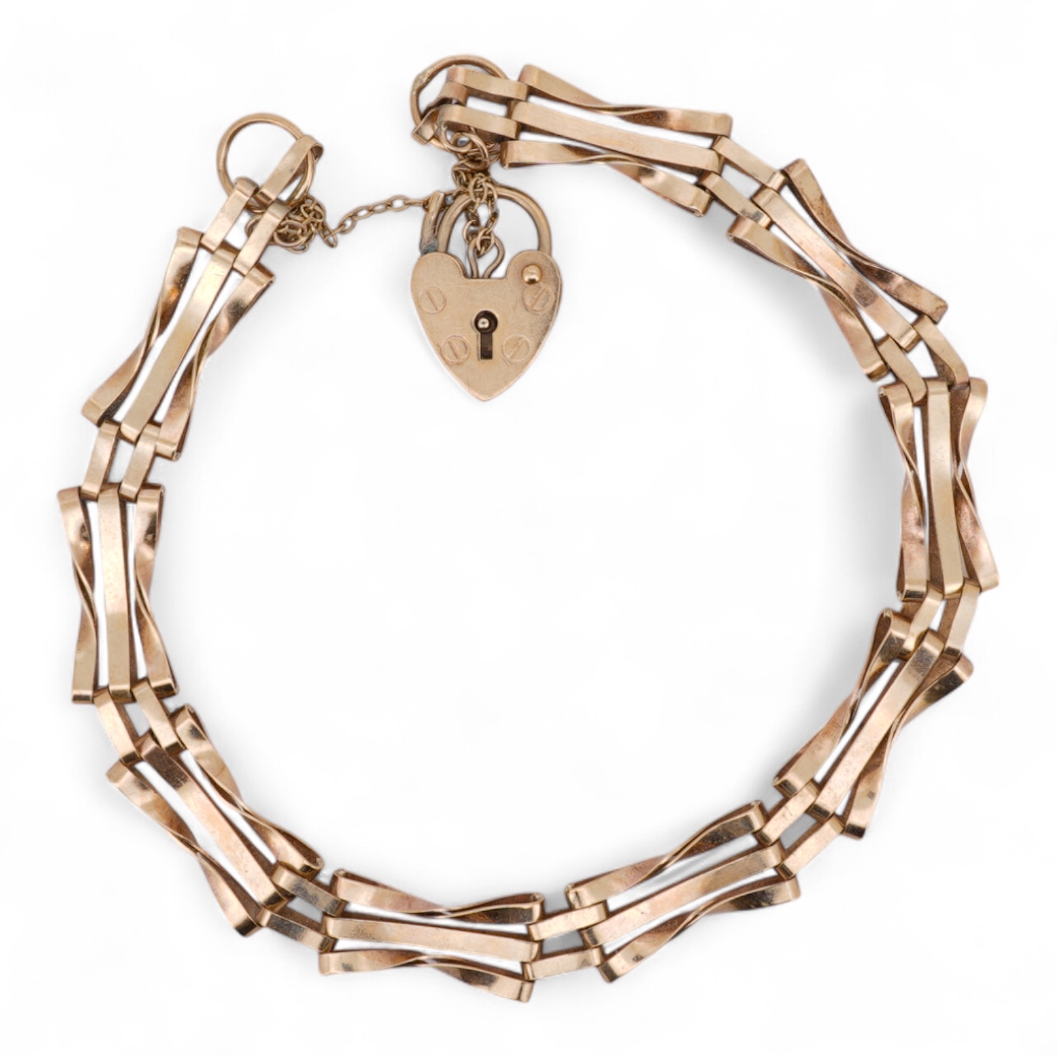 A 1980's 9ct gold gate link bracelet, with heart shaped padlock clasp, approx. 18cm, 5 grams.